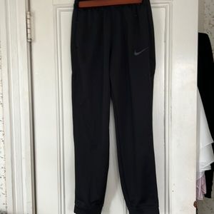 Nike joggers small, black with zip up mesh pockets.